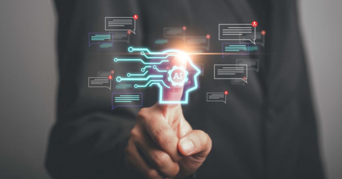Representação visual de agentes de IA, com um dedo apontando para um ícone brilhante em forma de perfil humano conectado por circuitos, com a sigla "AI" no centro. Ao redor, balões de texto estilizados sugerem comunicação e interação automatizada. O fundo desfocado e escuro reforça o foco na tecnologia, simbolizando o papel dos agentes de IA em processos inteligentes e dinâmicos (Agentes de IA, gartner, Shutterstock, Microsoft)